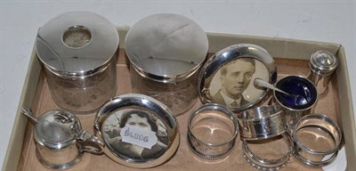 Lot 263 - A silver three piece condiment set, a pair of small circular silver photograph frames, four...