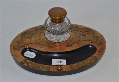 Lot 285 - A walnut encrier with single brass inkwell