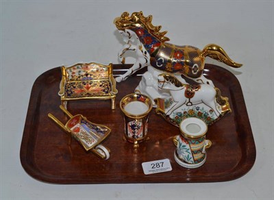 Lot 287 - A Royal Crown Derby paperweight Rocking Horse, a miniature bench (second), a wheel barrow, a...