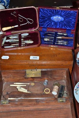 Lot 309 - A 19th century brass bound mahogany work box, an oak sewing box, two maroon leather cased sets...