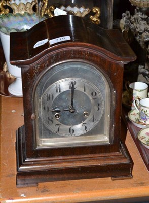 Lot 318 - A mahogany mantel clock with silvered dial