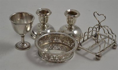 Lot 320 - A pair of silver desk candlesticks, an Italian white metal coaster and an electroplate egg cup...