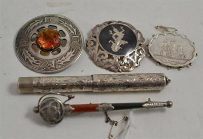 Lot 331 - A hardstone set sword brooch, a pen and three brooches