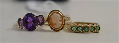 Lot 335 - A 9ct gold emerald five stone ring, a cameo ring and a 9ct gold amethyst ring (3)