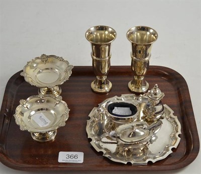 Lot 366 - A pair of Walker and Hall silver salts, a pair of loaded small vases, a three piece silver...