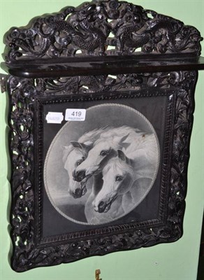 Lot 419 - An Oriental carved hardwood framed picture