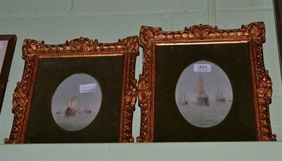 Lot 423 - A pair of small oval marine oils, framed