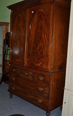 Lot 463 - A George IV mahogany linen press with brass strung decoration