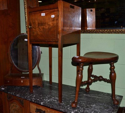 Lot 467 - A Georgian mahogany tray top night table, a toilet mirror and a saddle shaped stool