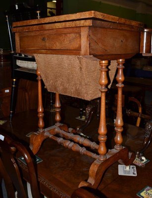 Lot 493 - A Victorian walnut foldover games/sewing table