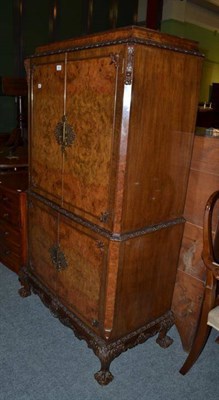 Lot 495 - Walnut cocktail cabinet