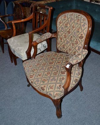 Lot 524 - A Victorian walnut framed open armchair in the Louis XV style and a Regency rope back elbow chair