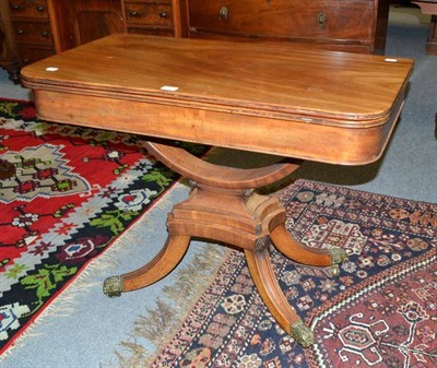 Lot 534 - A Regency mahogany fold-over swivel top tea table