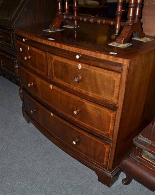 Lot 544 - A mahogany bow front low dressing chest with brushing slide