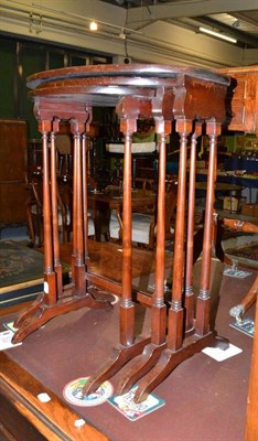 Lot 562 - A nest of three mahogany tables