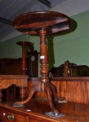 Lot 567 - A Georgian oak tripod table