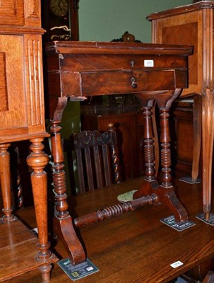 Lot 573 - A Victorian walnut work table on stretcher base