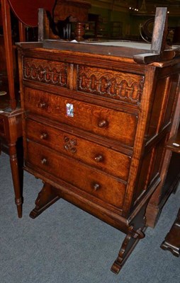 Lot 575 - A carved oak dressing chest with a swivel mirror superstructure