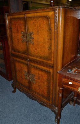 Lot 578 - A Denby and Spinks Ltd walnut cocktail cabinet in the Queen Anne style