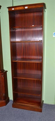 Lot 581 - A tall walnut open bookcase