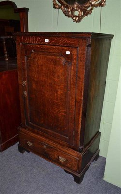 Lot 585 - An 18th century oak cupboard on stand