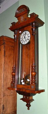 Lot 588 - A 19th century walnut Vienna style double weight driven wall clock