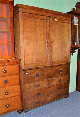 Lot 589 - A Victorian oak secretaire cabinet