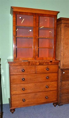 Lot 590 - A Victorian walnut glazed bookcase on an associated oak four height chest