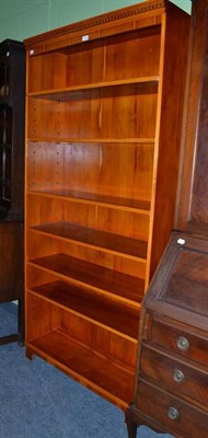 Lot 593 - A reproduction yew wood tall bookcase