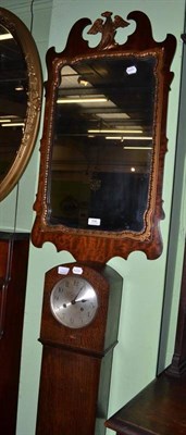 Lot 596 - A Georgian style fret carved wall mirror and a grandmother clock