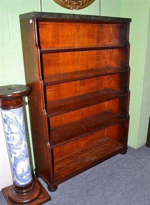 Lot 598 - Regency waterfall bookcase with later green marble top