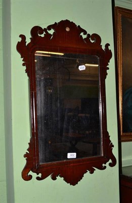 Lot 602 - A Georgian mahogany fret carved wall mirror