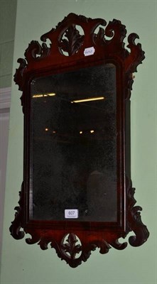 Lot 607 - 18th century walnut fret carved mirror