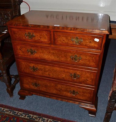 Lot 611 - A reproduction yew wood chest of drawers