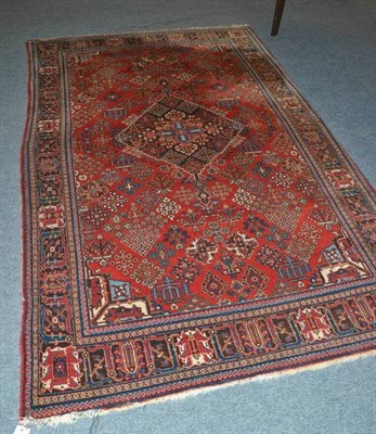 Lot 613 - A Joshagan rug central Persia the field with a lattice containing stylised palmette borders...