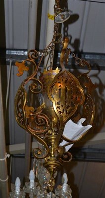 Lot 614 - Brass ecclesiastical style ceiling light with cranberry tipped shade