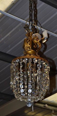 Lot 618 - Circular brass ceiling light with glass drops