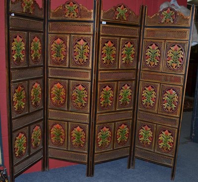 Lot 658 - An Indian pierced and painted four fold screen