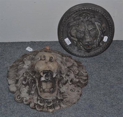 Lot 733 - A small circular lead lion mask water fountain and a larger concrete example