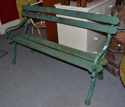 Lot 741 - A Victorian green painted cast iron and wood garden seat