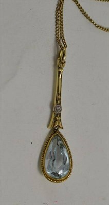 Lot 4 - An aquamarine and diamond set drop pendant stamped '14k' on a 9ct gold chain