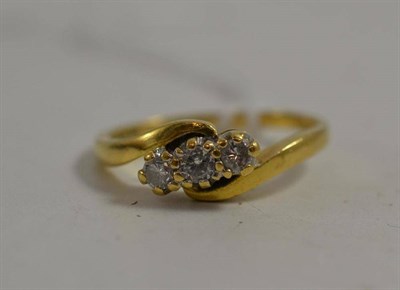 Lot 14 - An 18ct gold diamond three stone ring