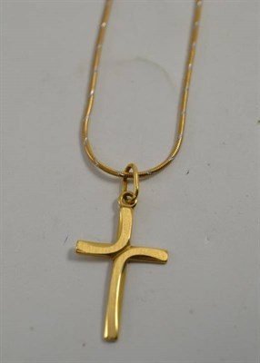 Lot 32 - A 9ct two colour gold snake chain, hung with a cross stamped '750'