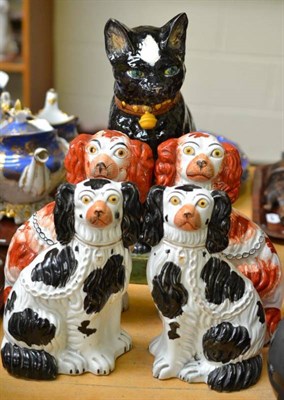 Lot 72 - Portuguese pottery cat and two pairs of Staffordshire dogs