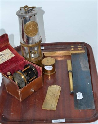 Lot 79 - A Davy lamp, a set square, an air meter, a rape gauge and a tension meter
