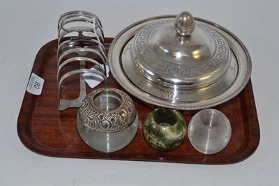 Lot 80 - A silver and plate muffin dish, three match strikers and a plated toast rack