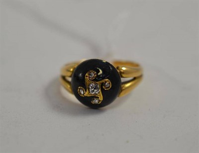 Lot 109 - A diamond set black enamelled mourning ring
