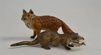 Lot 116 - A cold painted bronze fox (10cm long) and another of an otter with a fish in its mouth (2)