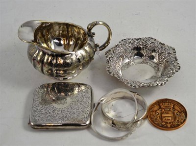 Lot 124 - A silver cigarette case, two bracelets, a bonbon dish, a gilt medal and a jug