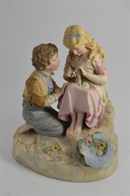 Lot 129 - Continental bisque figure group of two children, height 36cm